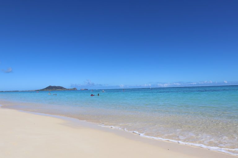 Lanikai Beach in Oahu with perfect white sand and blue waters and mountain views